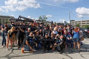 Supporters pose for a group photo after a bus trip to Indy. (Photo: Jeremy Olson)