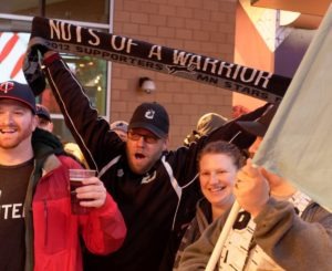 Rich Harrison holds up the Nuts Of A Warrior Scarf (Photo: Jeremy Olson)