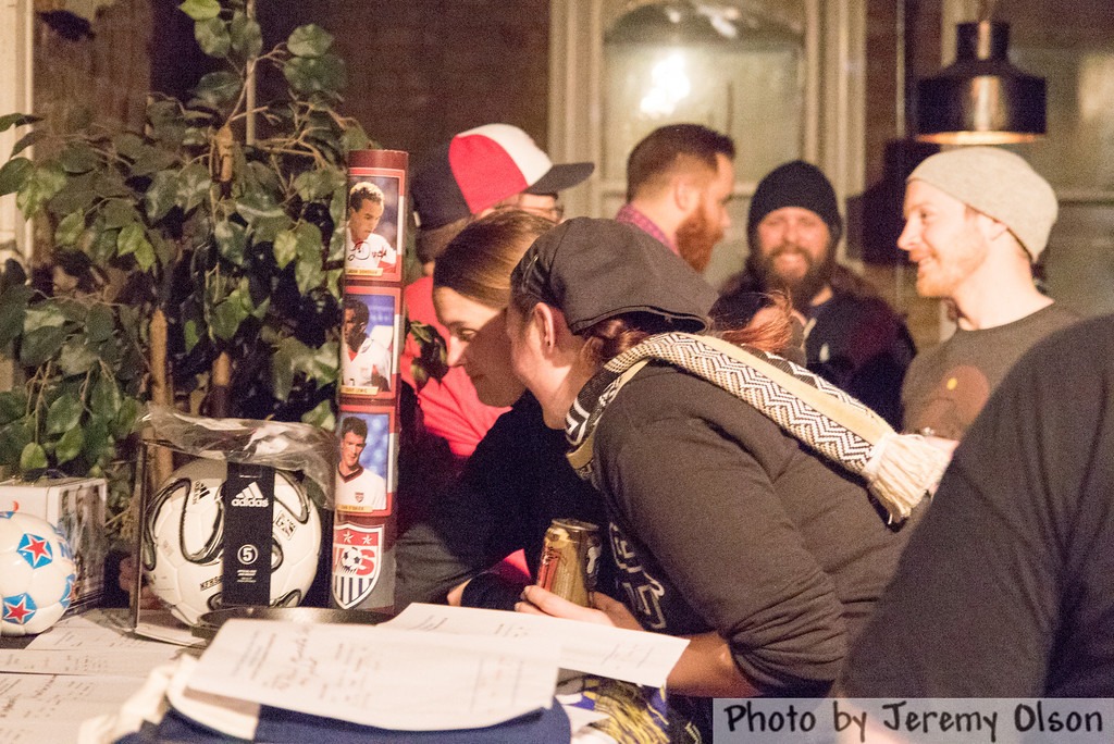 People perusing items at a past silent auction. (Photo: Jeremy Olson)