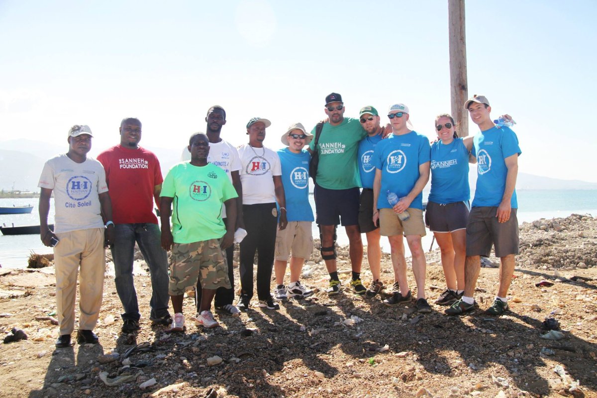Silver Lining Volunteers (in blue t-shirts) with Haitian Initiative staff and Tony Sanneh (in dark green t-shirt with sunglasses).