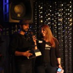 Sam presenting Nach with an award at the 2019 end of the season party