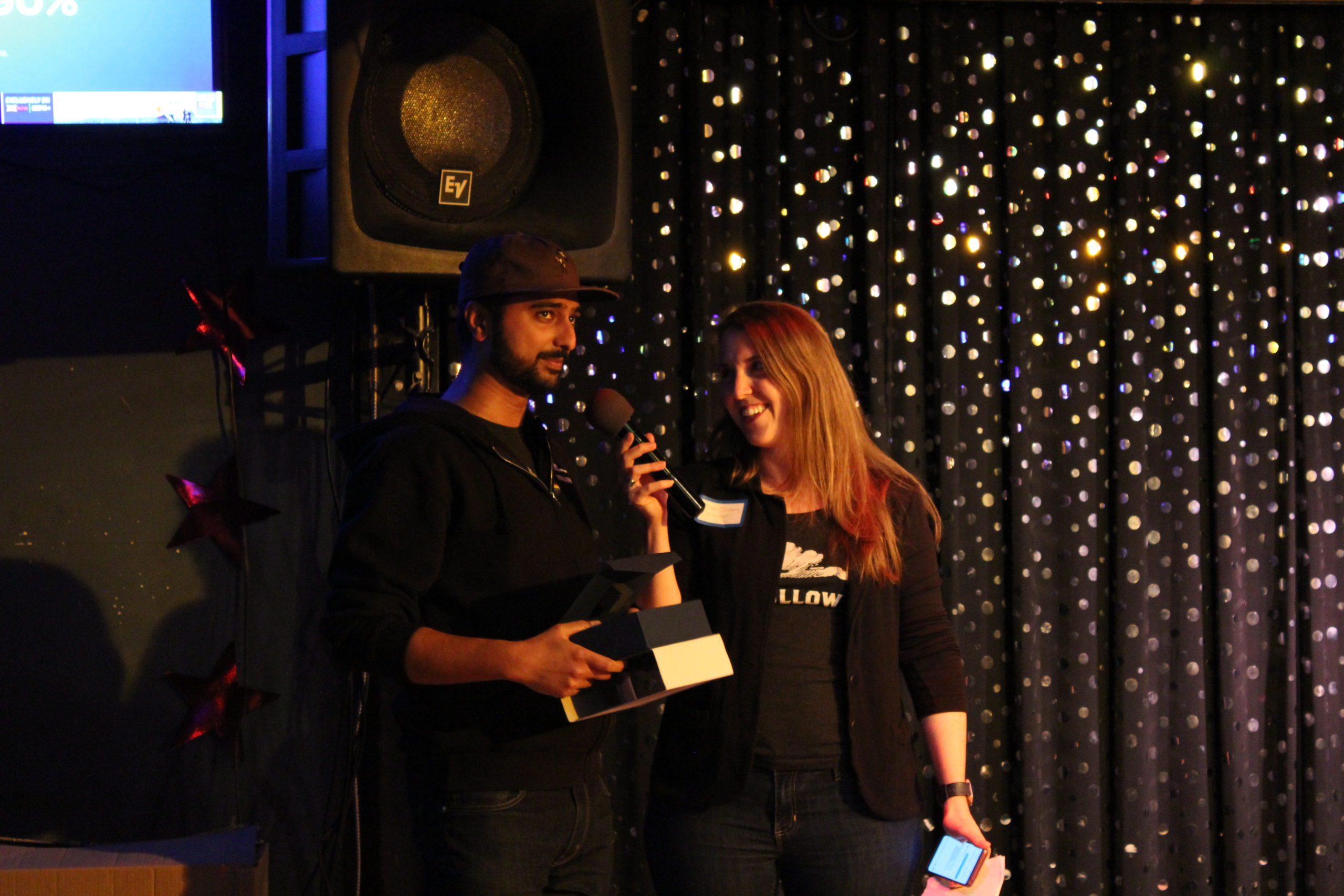 Sam presenting Nach with an award at the 2019 end of the season party