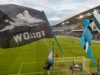Several flags, including Dark clouds follow flag over field during Seattle and MNUFC game at Allianz field