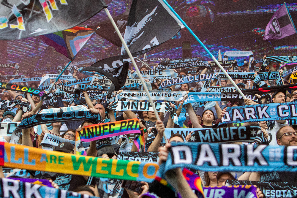 Dark Clouds Flags and Scarves being held up in the Wonderwall